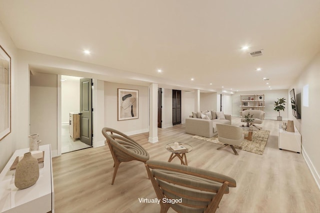 living room with baseboards, recessed lighting, visible vents, and light wood-type flooring