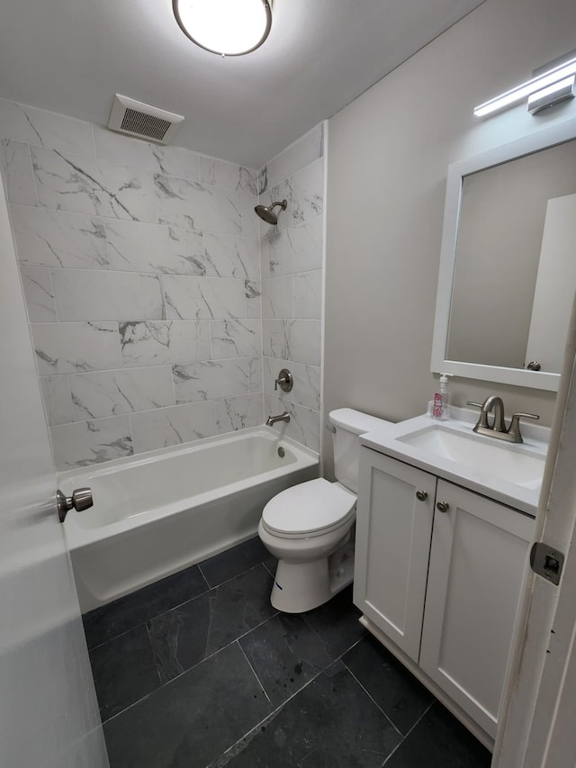 bathroom featuring vanity, toilet, visible vents, and shower / bathtub combination