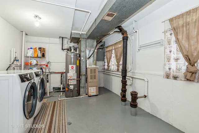 below grade area featuring visible vents, washer and dryer, and gas water heater