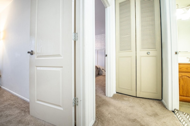 corridor featuring light carpet