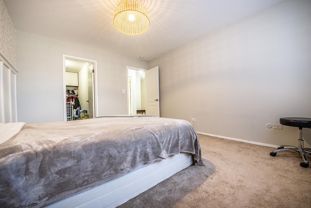 carpeted bedroom with baseboards