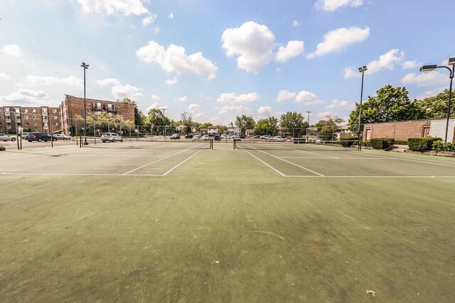 view of tennis court with fence