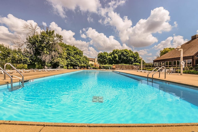 community pool featuring a patio area