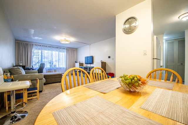 dining space with carpet floors