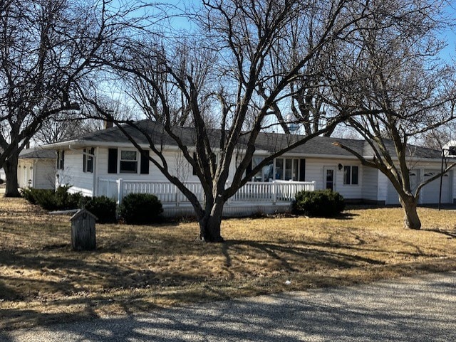 view of front of home with a porch and a garage