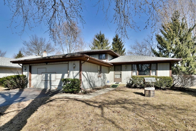 view of front of house featuring concrete driveway and a garage