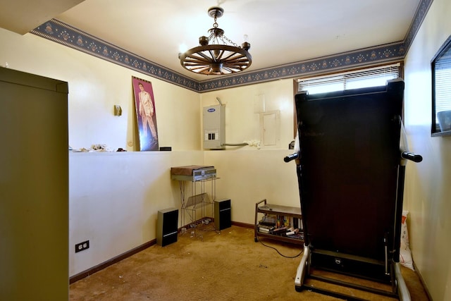 workout room with an inviting chandelier, carpet flooring, and baseboards