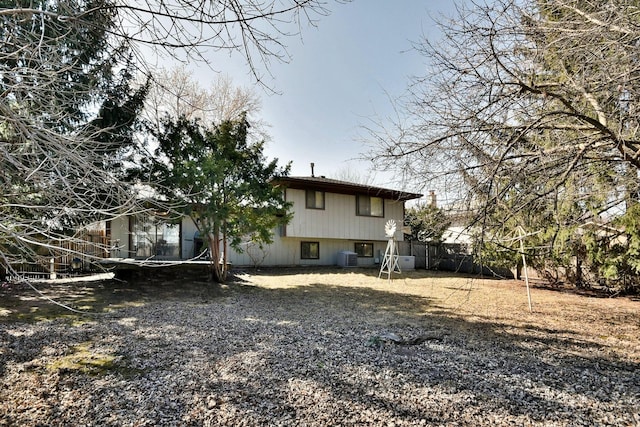 back of house featuring fence