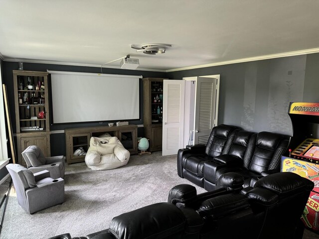 carpeted cinema room featuring ornamental molding