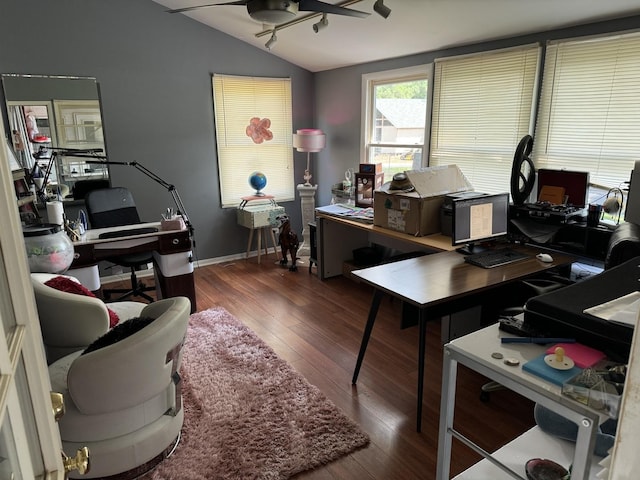 office space with baseboards, lofted ceiling, hardwood / wood-style floors, and a ceiling fan