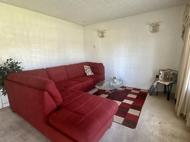 carpeted living room with a textured ceiling