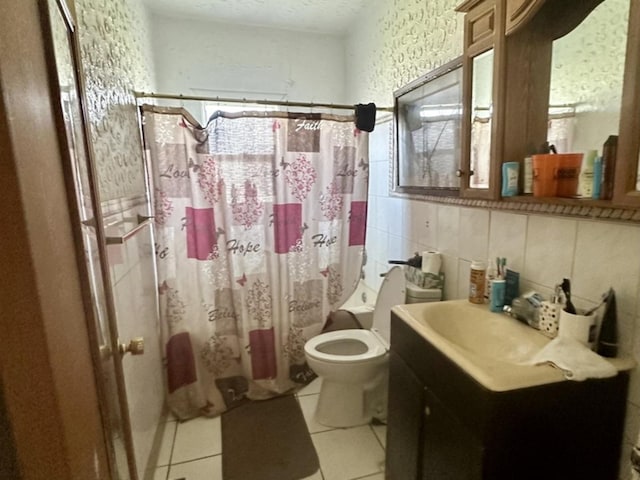 bathroom featuring shower / bath combo with shower curtain, toilet, vanity, tile patterned floors, and a textured ceiling