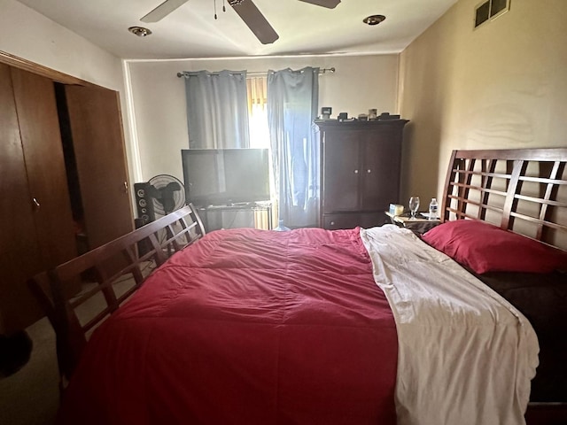 bedroom featuring a ceiling fan and visible vents