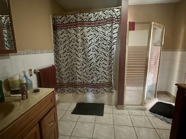 bathroom with vanity, tile walls, and tile patterned floors