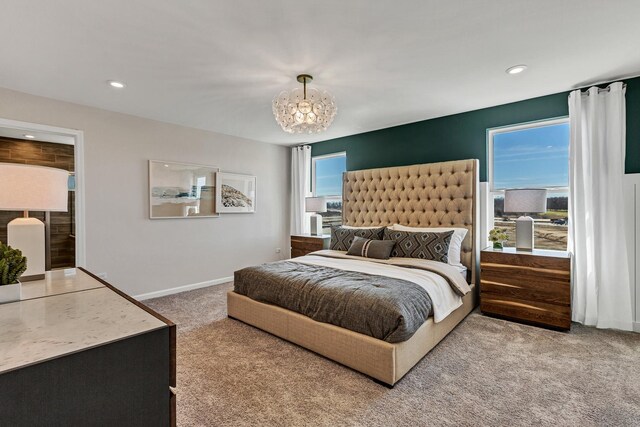 carpeted bedroom with recessed lighting, baseboards, and a chandelier