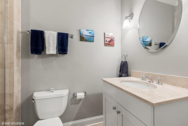 full bath featuring baseboards, toilet, and vanity