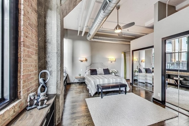 bedroom with ceiling fan, baseboards, and dark wood-style floors