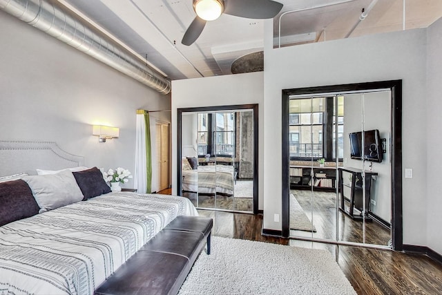 bedroom featuring wood finished floors, baseboards, and ceiling fan