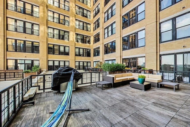 exterior space featuring a grill and outdoor lounge area