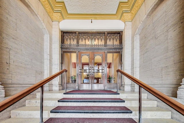 stairway with a towering ceiling