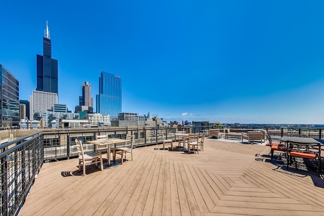 wooden terrace featuring a view of city