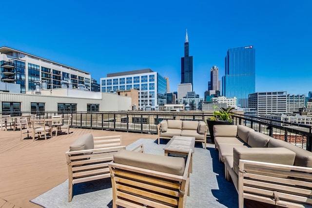 view of patio / terrace with a view of city and an outdoor hangout area