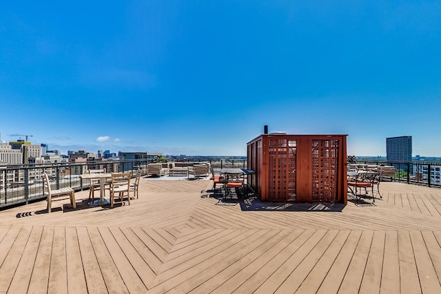 wooden terrace featuring a city view