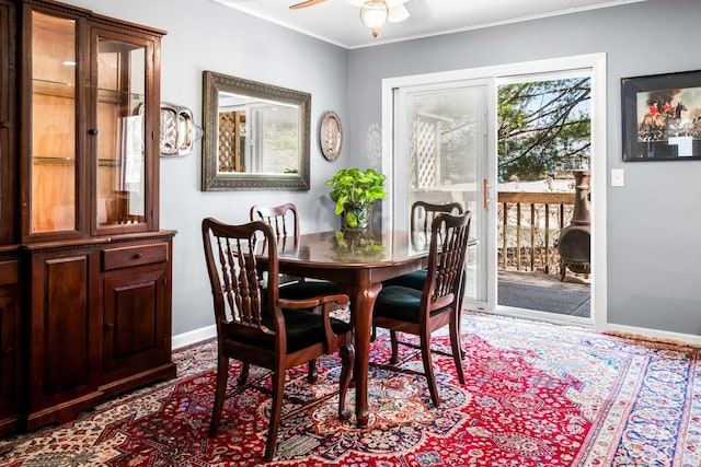 dining space with baseboards, ceiling fan, and ornamental molding