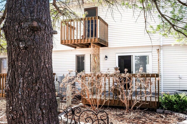 back of house with a balcony