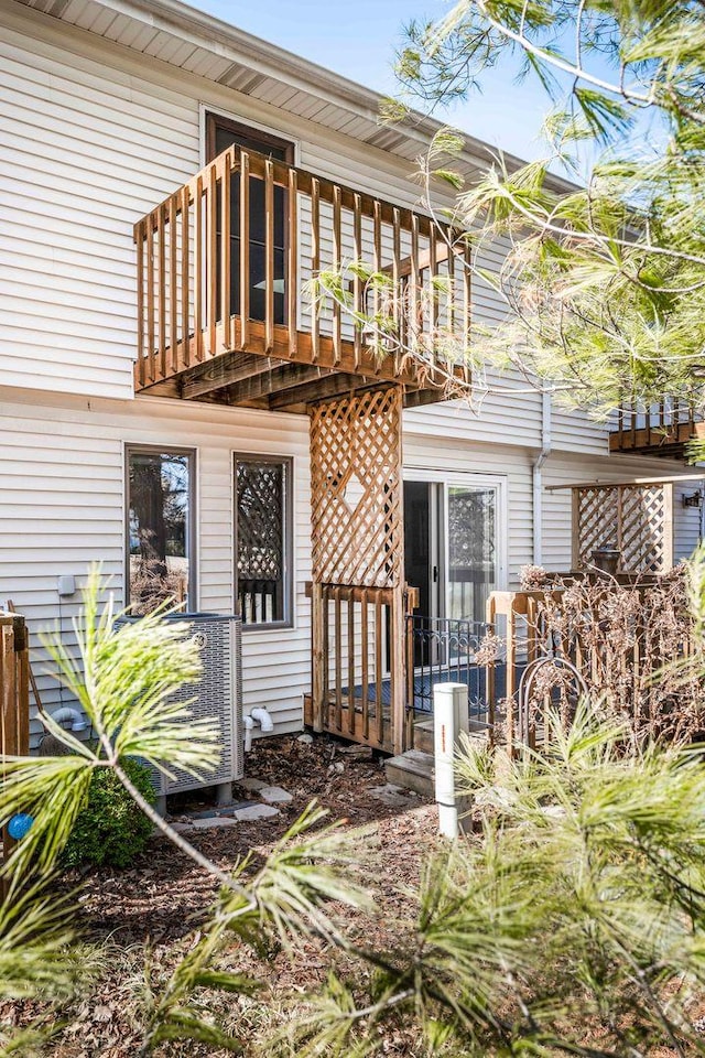 back of property with a wooden deck