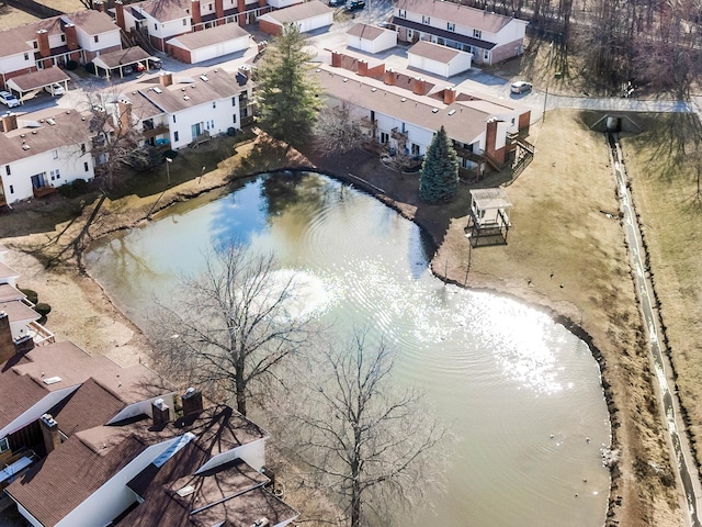 drone / aerial view featuring a residential view and a water view