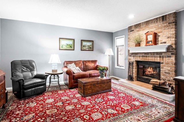 living room featuring baseboards, a textured ceiling, and a fireplace