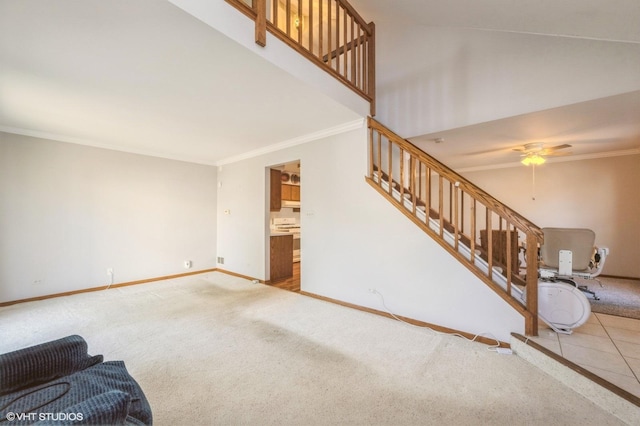 living room featuring ornamental molding, stairway, carpet floors, baseboards, and ceiling fan
