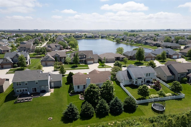 drone / aerial view featuring a residential view and a water view