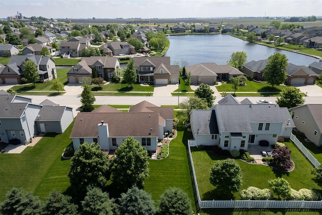 birds eye view of property with a residential view and a water view