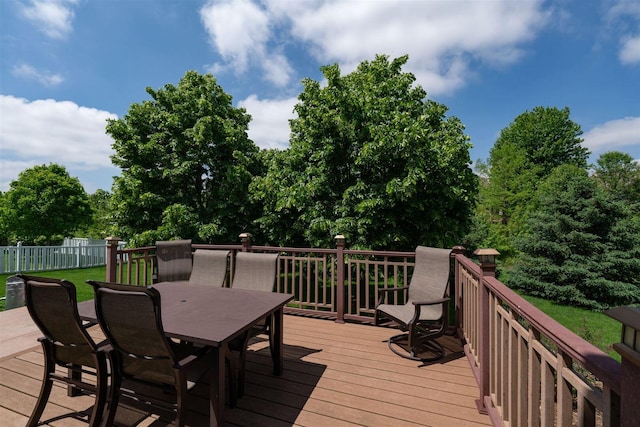 wooden terrace featuring outdoor dining area and fence