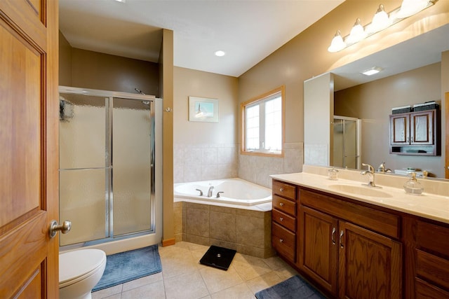 full bathroom featuring toilet, a garden tub, a stall shower, tile patterned floors, and vanity