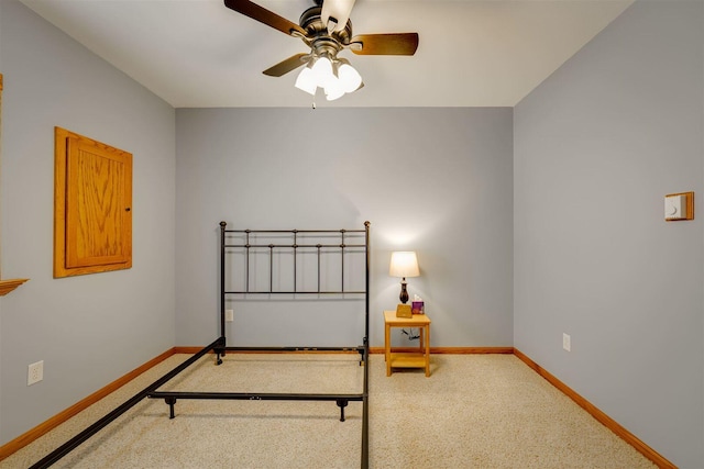 bedroom featuring baseboards and a ceiling fan