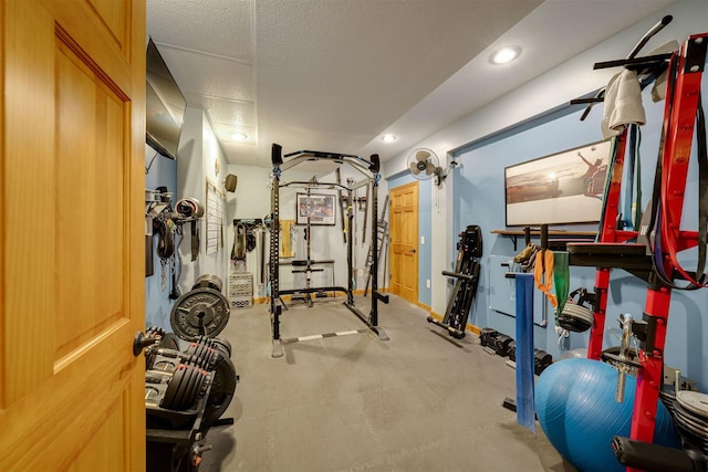 workout area with recessed lighting and a textured ceiling