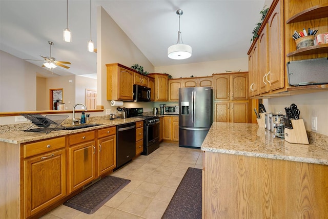 kitchen featuring range with gas cooktop, stainless steel fridge with ice dispenser, dishwasher, light stone counters, and a sink