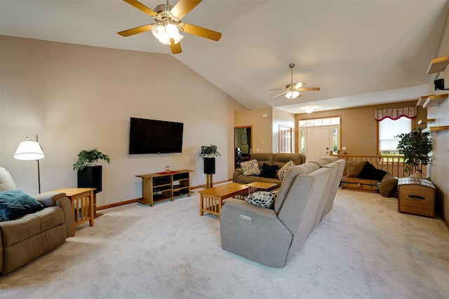 living area with light carpet, baseboards, high vaulted ceiling, and ceiling fan