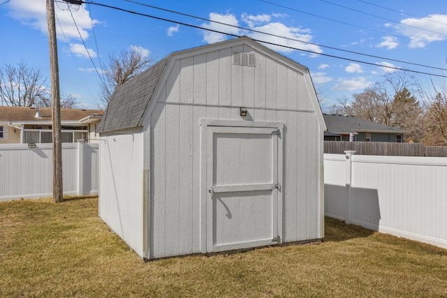 view of shed with a fenced backyard