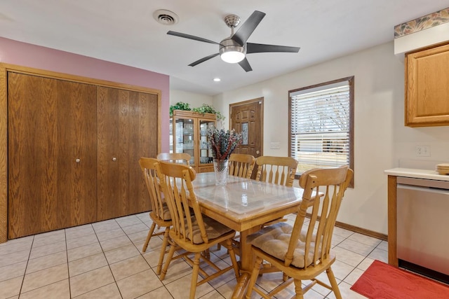 dining room featuring light tile patterned flooring, baseboards, visible vents, and ceiling fan