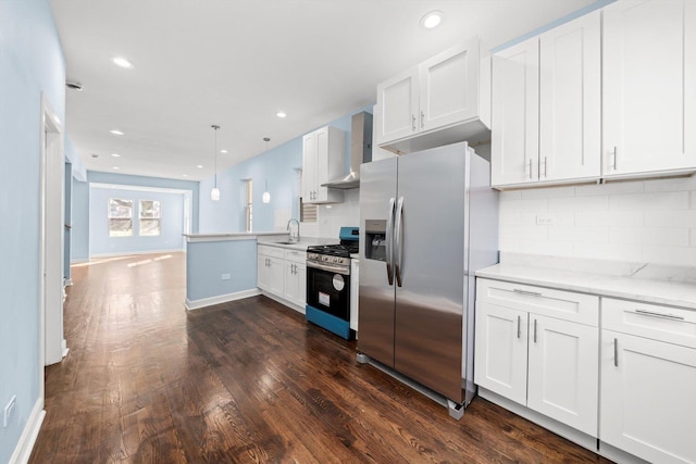 kitchen with backsplash, dark wood-style floors, stainless steel appliances, a peninsula, and wall chimney exhaust hood