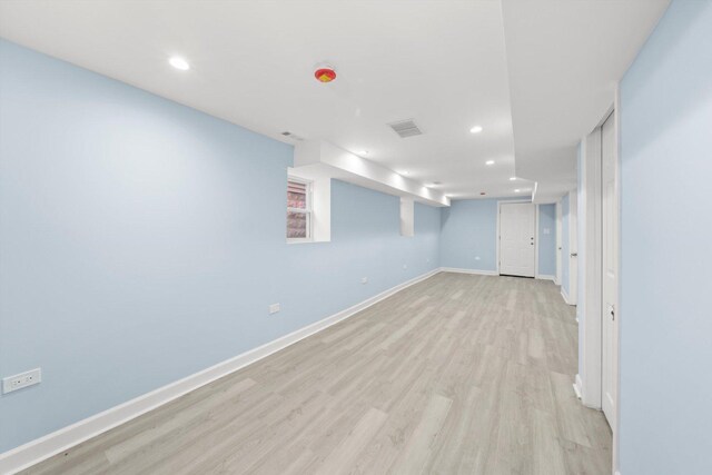 spare room with visible vents, recessed lighting, light wood-type flooring, and baseboards