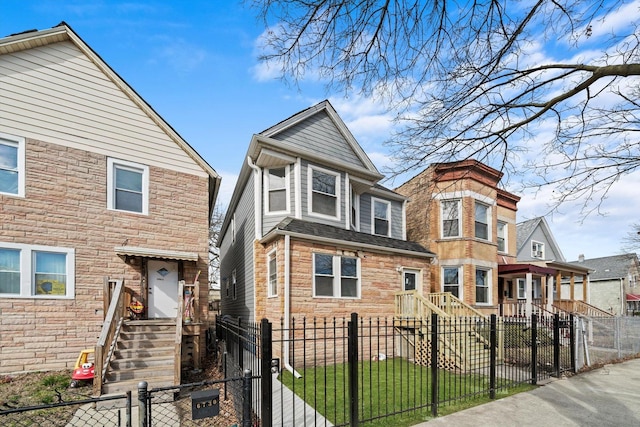 view of front of house featuring a gate and a fenced front yard