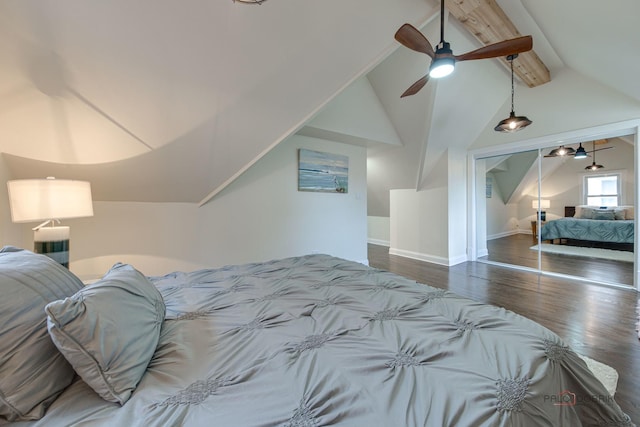 bedroom with lofted ceiling with beams, wood finished floors, baseboards, and ceiling fan