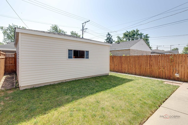 view of yard featuring an outbuilding and a fenced backyard