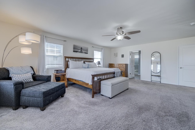 bedroom with a ceiling fan, baseboards, and carpet floors