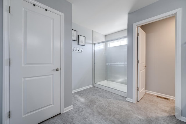 full bath featuring visible vents, baseboards, and a stall shower